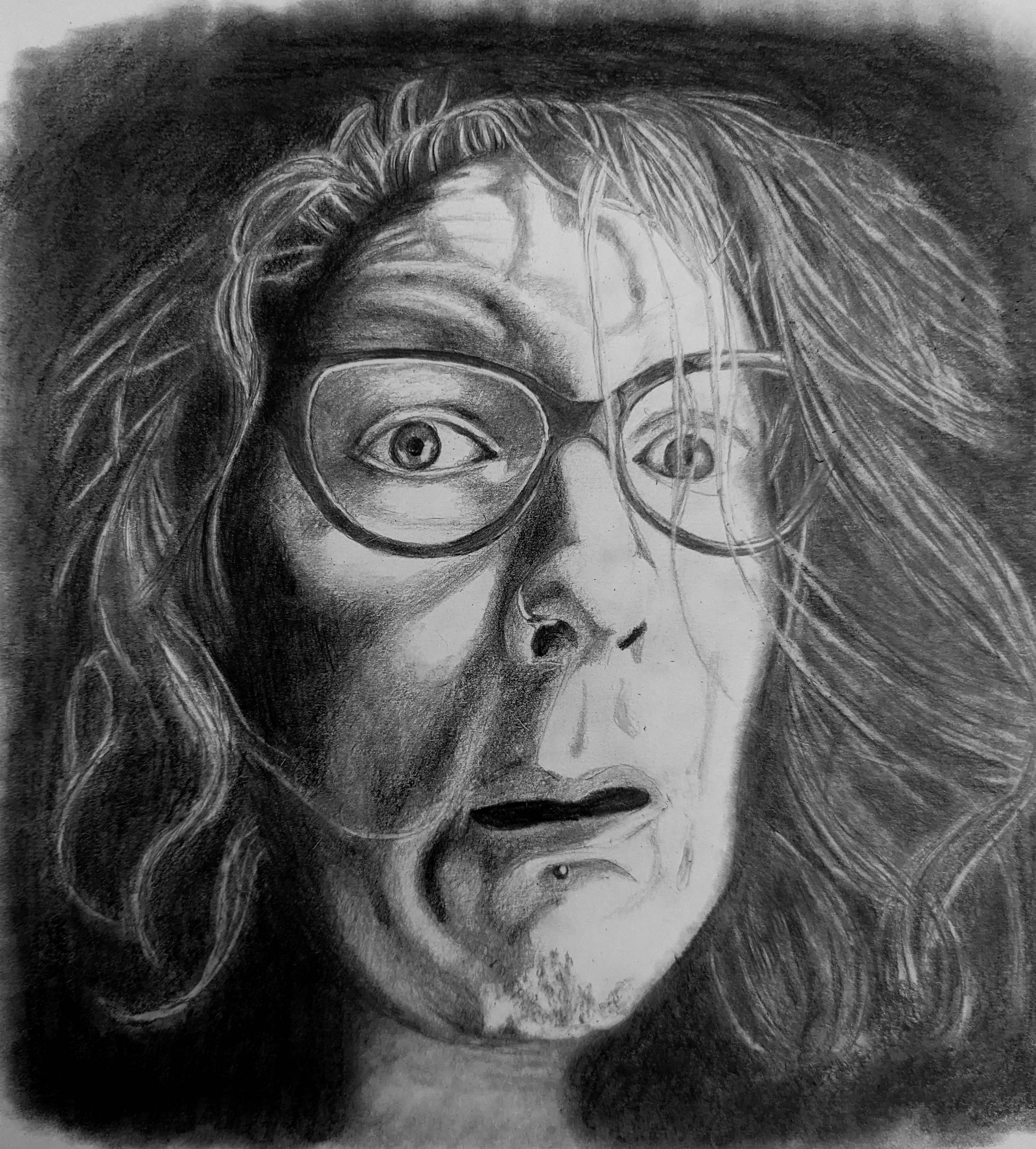 Image of a woman with dark glasses with a surprised look on her face. The image is on a black background and has white hair that does not look combed.